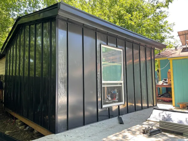 Black standing seam metal wall panels for Roof Inspection in Williston Park