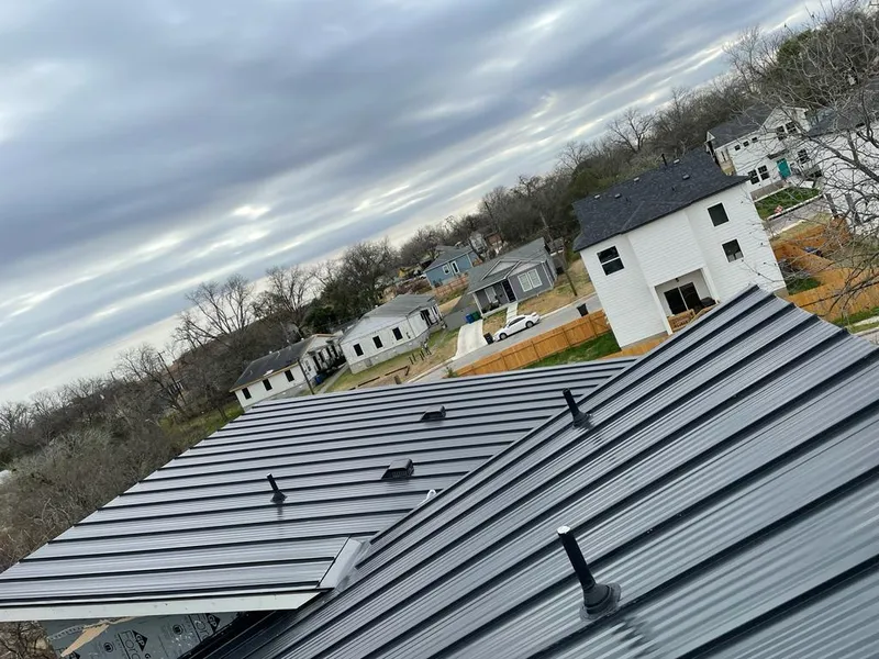 Standing seam metal roof panels with vents for Skylight Repair in Williston Park